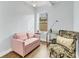 Small office space with pink couch and armchair at 305 Pameto Rd, Nokomis, FL 34275