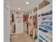 Large walk-in closet with ample shelving and hanging space at 305 Pameto Rd, Nokomis, FL 34275