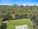 Expansive backyard with lush green lawn and serene water views, providing a private outdoor oasis at 3151 Johannesberg Rd, North Port, FL 34288