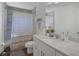 Clean bathroom with marble vanity, and tile shower with a curtain at 3151 Johannesberg Rd, North Port, FL 34288