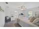 Inviting bedroom with neutral color palette, a ceiling fan, and en-suite bathroom at 3151 Johannesberg Rd, North Port, FL 34288