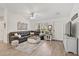 Cozy living room with hardwood floors, natural light, leather sofa, and stylish decor at 3151 Johannesberg Rd, North Port, FL 34288