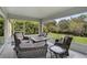 Inviting screened lanai with comfortable seating and picturesque backyard water views creates an excellent outdoor space at 3151 Johannesberg Rd, North Port, FL 34288