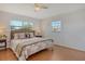 Main bedroom with light wood floors and comfortable bed at 328 San Marco Ave, North Port, FL 34287