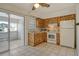 Cozy kitchen with wood cabinets and white appliances at 328 San Marco Ave, North Port, FL 34287