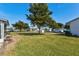 Backyard of property with green grass and trees at 3701 39Th W St, Bradenton, FL 34205