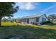 Backyard view of the property, showcasing a large grassy area at 3701 39Th W St, Bradenton, FL 34205