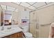 Clean bathroom with shower, toilet and wood vanity at 3701 39Th W St, Bradenton, FL 34205