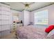 Serene bedroom with double bed and built-in shelving at 3701 39Th W St, Bradenton, FL 34205