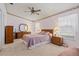 Bright bedroom with double bed, mirrored closet, and wood dresser at 3701 39Th W St, Bradenton, FL 34205