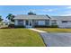 Front view of a single-story house with a well-maintained lawn at 3701 39Th W St, Bradenton, FL 34205