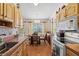 Open kitchen with wood cabinets and a breakfast nook at 3701 39Th W St, Bradenton, FL 34205