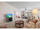 Living room with floral sofa, rocking chairs and TV at 3701 39Th W St, Bradenton, FL 34205