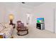 Bright living room featuring comfy seating and a large TV at 3701 39Th W St, Bradenton, FL 34205