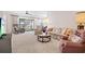 Living room with floral sofa, rocking chairs and TV at 3701 39Th W St, Bradenton, FL 34205