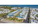 Aerial view of a waterfront community featuring multiple buildings and parking at 3810 Gulf Of Mexico Dr # F302, Longboat Key, FL 34228