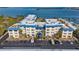 Aerial view of waterfront community with parking and boat slips at 3810 Gulf Of Mexico Dr # F302, Longboat Key, FL 34228