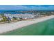 Aerial view of building and beach at 3810 Gulf Of Mexico Dr # F302, Longboat Key, FL 34228