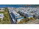 Aerial view showcasing a large community of buildings near the water at 3810 Gulf Of Mexico Dr # F302, Longboat Key, FL 34228