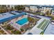Aerial view of community pool, shuffleboard, and building at 3810 Gulf Of Mexico Dr # F302, Longboat Key, FL 34228