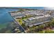 Aerial view of the building highlighting its waterfront setting and parking at 3810 Gulf Of Mexico Dr # F302, Longboat Key, FL 34228