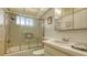 Clean bathroom with shower/tub combo and updated vanity at 3810 Gulf Of Mexico Dr # F302, Longboat Key, FL 34228