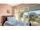 Bedroom with water views and twin bed at 3810 Gulf Of Mexico Dr # F302, Longboat Key, FL 34228