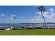 Community boat docks on calm water under a sunny sky at 3810 Gulf Of Mexico Dr # F302, Longboat Key, FL 34228