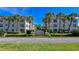 Attractive building entrance with landscaping at 3810 Gulf Of Mexico Dr # F302, Longboat Key, FL 34228