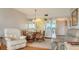 Cozy dining area with seating for four at 3810 Gulf Of Mexico Dr # F302, Longboat Key, FL 34228