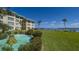 Waterfront property with lush landscaping and fountain at 3810 Gulf Of Mexico Dr # F302, Longboat Key, FL 34228
