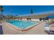 Refreshing community pool, ample seating and patio space at 3810 Gulf Of Mexico Dr # F302, Longboat Key, FL 34228