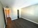 Bright bedroom with wood-look floors and spacious closets at 425 30Th W Ave # C212, Bradenton, FL 34205