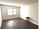 Spacious bedroom with dark gray laminate flooring and window coverings at 425 30Th W Ave # C212, Bradenton, FL 34205