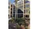 Condo building with lush landscaping and screened balconies at 425 30Th W Ave # C212, Bradenton, FL 34205
