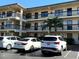 Two-story condo building with parking and landscaping at 425 30Th W Ave # C212, Bradenton, FL 34205