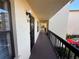Condo hallway with exterior access and neutral paint at 425 30Th W Ave # C212, Bradenton, FL 34205