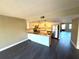 Open concept kitchen with breakfast bar and stainless steel appliances at 425 30Th W Ave # C212, Bradenton, FL 34205