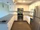 Updated kitchen with stainless steel appliances and granite countertops at 425 30Th W Ave # C212, Bradenton, FL 34205
