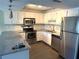 Updated kitchen with stainless steel appliances and granite countertops at 425 30Th W Ave # C212, Bradenton, FL 34205