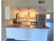 Updated kitchen with island and stainless steel appliances at 425 30Th W Ave # C212, Bradenton, FL 34205