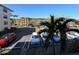 View of parking lot with cars parked, and surrounding buildings at 425 30Th W Ave # C212, Bradenton, FL 34205