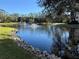 Serene pond with fountain and lush greenery surrounding condo community at 425 30Th W Ave # C212, Bradenton, FL 34205