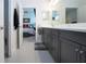 Modern bathroom with double vanity and gray cabinets at 4304 Fly Rod Ter, Parrish, FL 34219