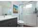 Bathroom with walk-in shower and gray vanity at 4304 Fly Rod Ter, Parrish, FL 34219