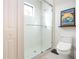 Modern bathroom with a glass shower enclosure and updated toilet at 4304 Fly Rod Ter, Parrish, FL 34219