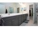 Spa-like bathroom with double vanity and a view into bedroom at 4304 Fly Rod Ter, Parrish, FL 34219