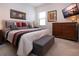 Bright bedroom with king-size bed and wood dresser at 4304 Fly Rod Ter, Parrish, FL 34219