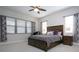 Main bedroom with a king-size bed and ceiling fan at 4304 Fly Rod Ter, Parrish, FL 34219