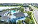 Community clubhouse and pool area with palm trees and ample parking at 4304 Fly Rod Ter, Parrish, FL 34219